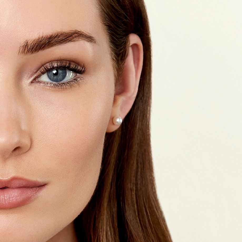 Close-up of a woman's face with a neutral background