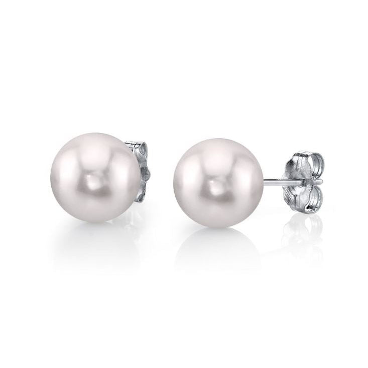 Pair of pearl earrings on a white background